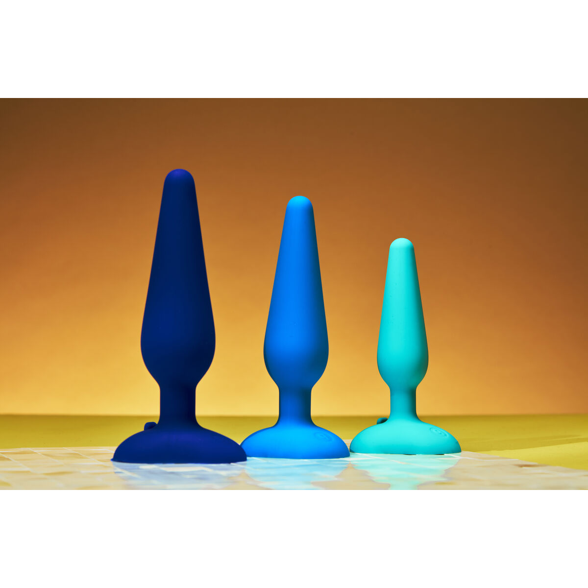 Neonově růžový malý nabíjecí anální kolík B-Vibe Modrý (10 cm) (12 cm)